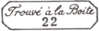 Marque encadrée avec mention TROUVE A LA BOITE et numéro de bureau de quartier 22 /